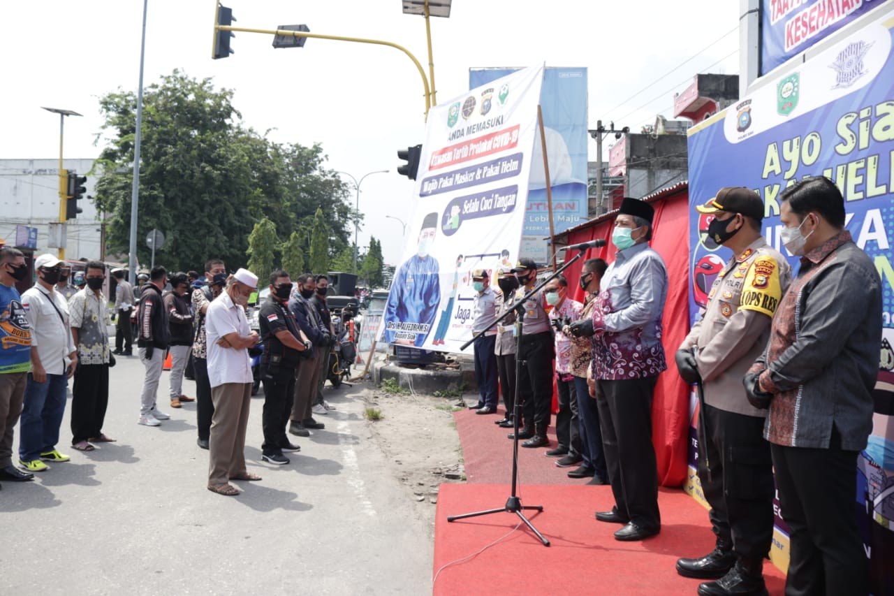 Bupati Siak dan Kapolres Canangkan Kawasan Wajib Helm dan Masker di Jalan Raya Perawang